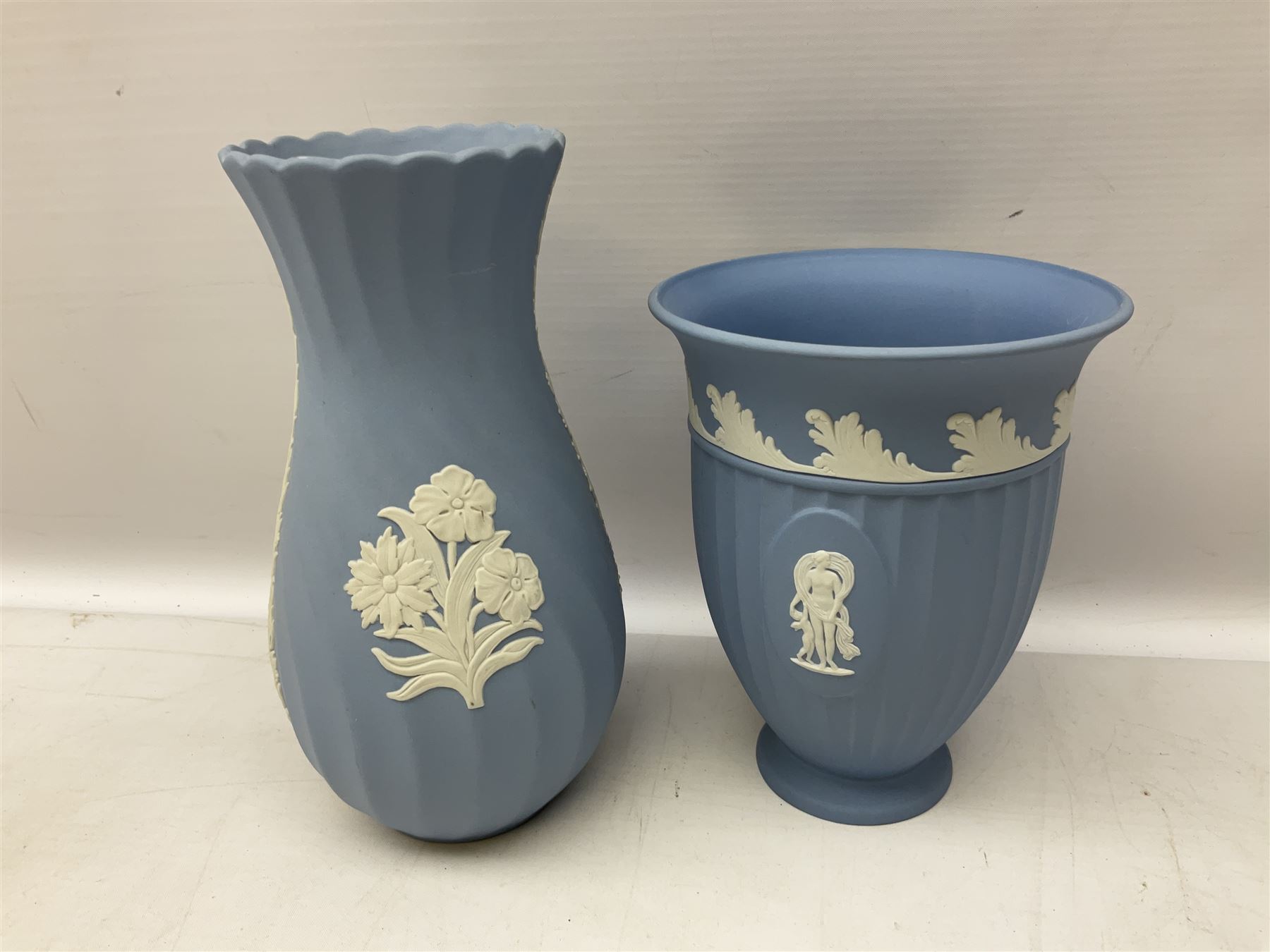 Wedgwood pale blue Jasperware, to include a pair of tulip vases, large vase with fluted rim, trinket dishes, trinket box etc, together with Wedgwood miniature hanging decoration in the form of a tea set 