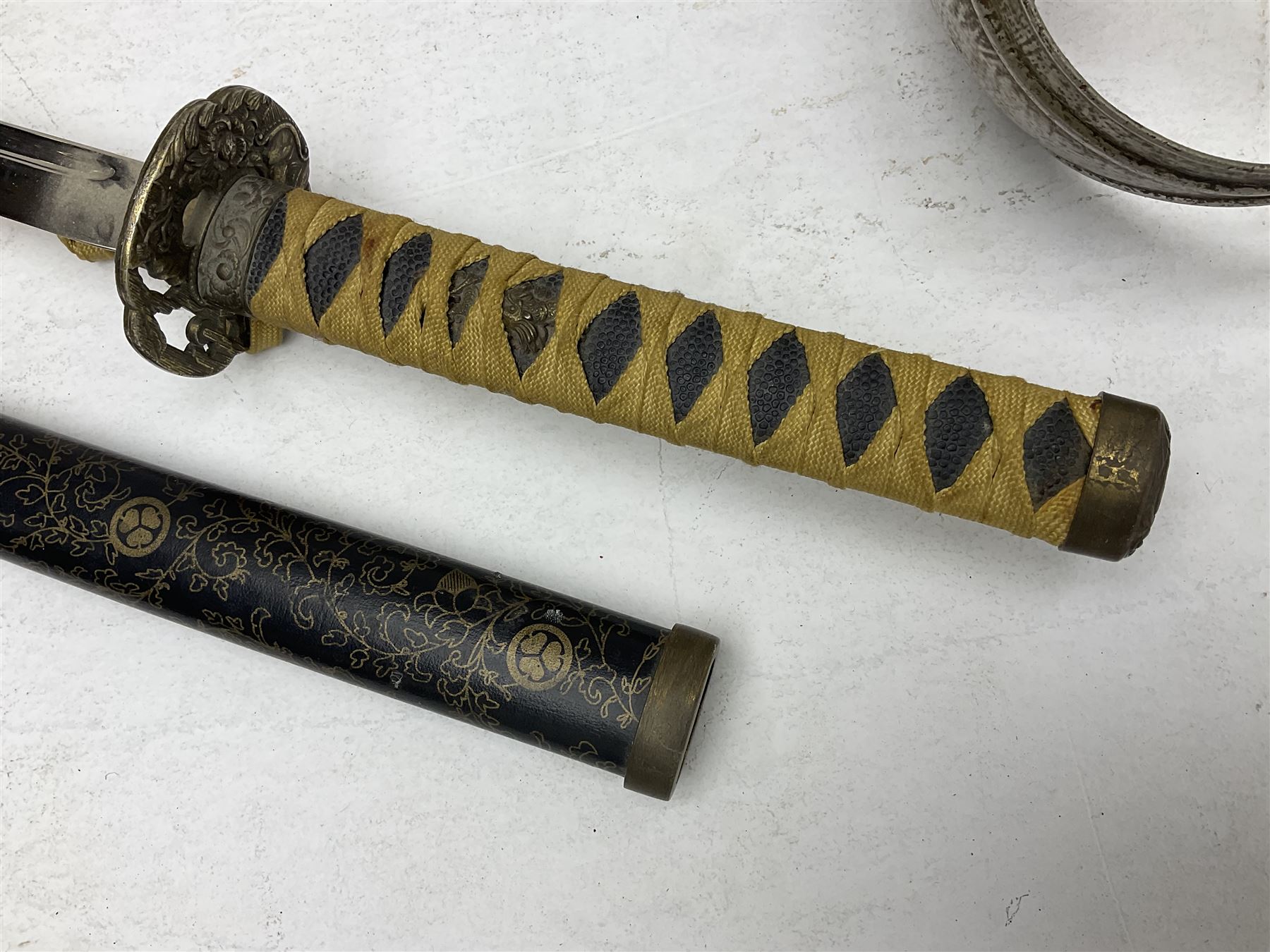 Reproduction Japanese katana with 63cm slightly curving fullered steel blade, ornate tsuba, cord bound grip and gilt transferred black saya L92cm; and two fencing foils, one marked Leon Paul (3)