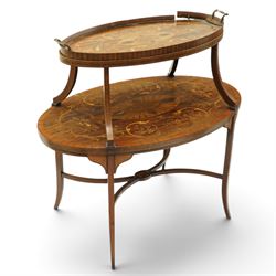 Edwardian Sheraton Revival inlaid mahogany and satinwood marquetry oval two-tier étagère occasional table, the oval top with removable glazed tray with brass handles, over an ornately inlaid top with central patera motif and trailing foliate scrolls, the splayed uprights inlaid with bellflowers, over a matched inlay under-tier, raised on splayed supports united by curved X-stretcher,  retailed by David Hick Interiors, Jersey