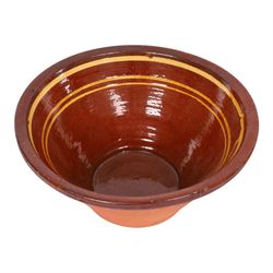 19th century terracotta bread pancheon, of circular form, the glazed interior with slip decoration, H21cm, D43cm