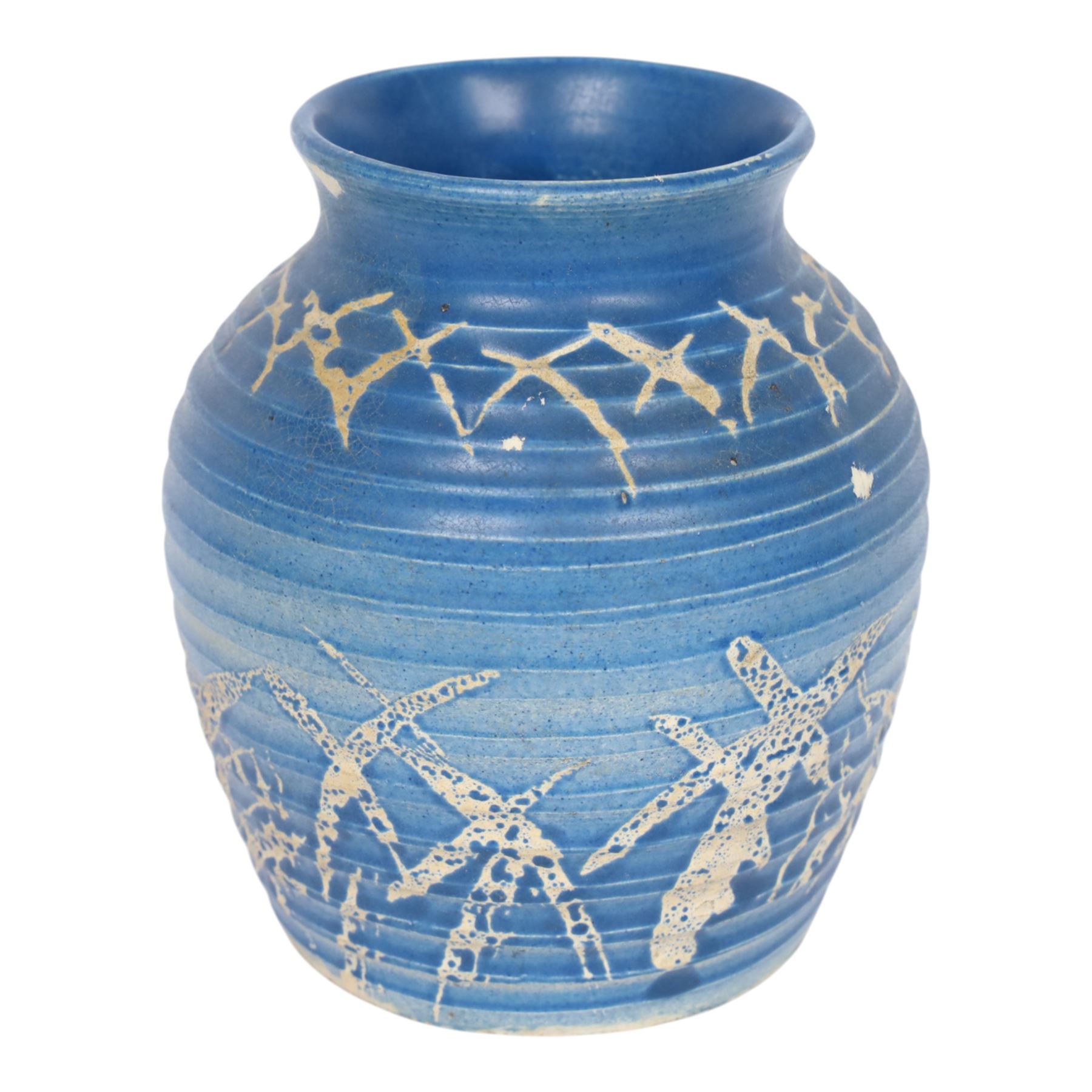 Quentin Bell 1910-1996: ribbed vase with fluted rim, decorated in white abstract design on a blue ground, signed Bell beneath, H16cm 