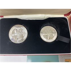 Coins including two King George VI 1951 Festival of Britain crowns each in green case, various other commemorative crowns, two Iceland '874-1974' two coin sets both in original red cases etc