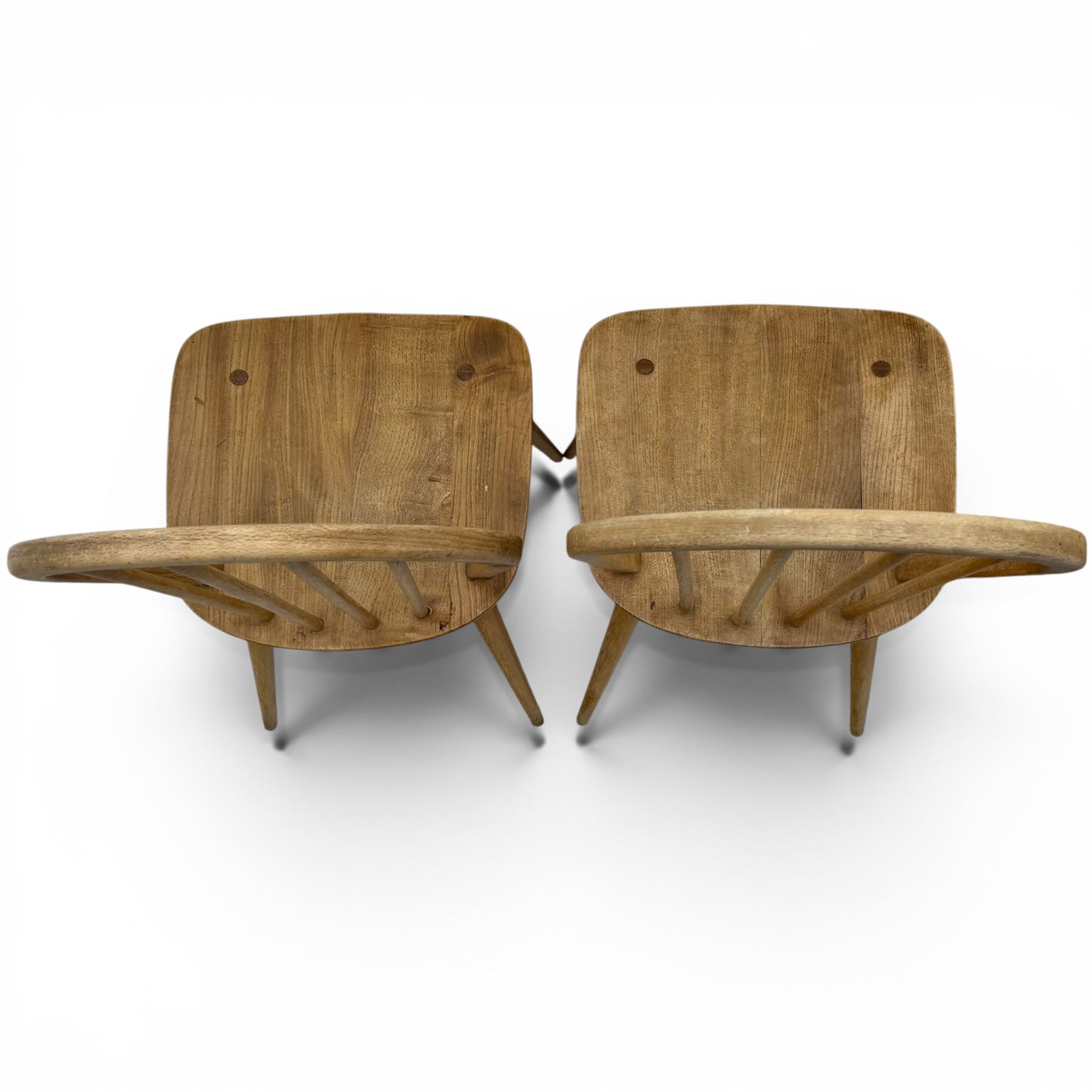 Ercol - set of four elm 'Windsor' chairs, hoop design back dish seat, tapering supports united by H-stretcher 