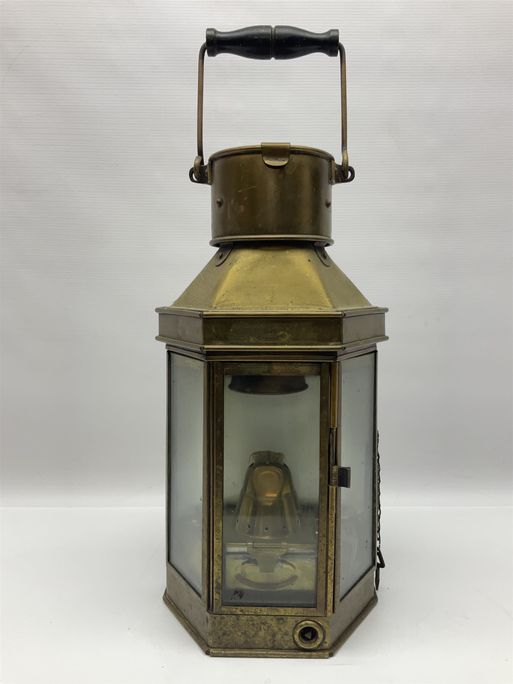Large brass maritime lamp by Griffiths & Sons Birmingham with swing handle, threaded mounting bracket and associated oil burner, H41cm excluding handle
