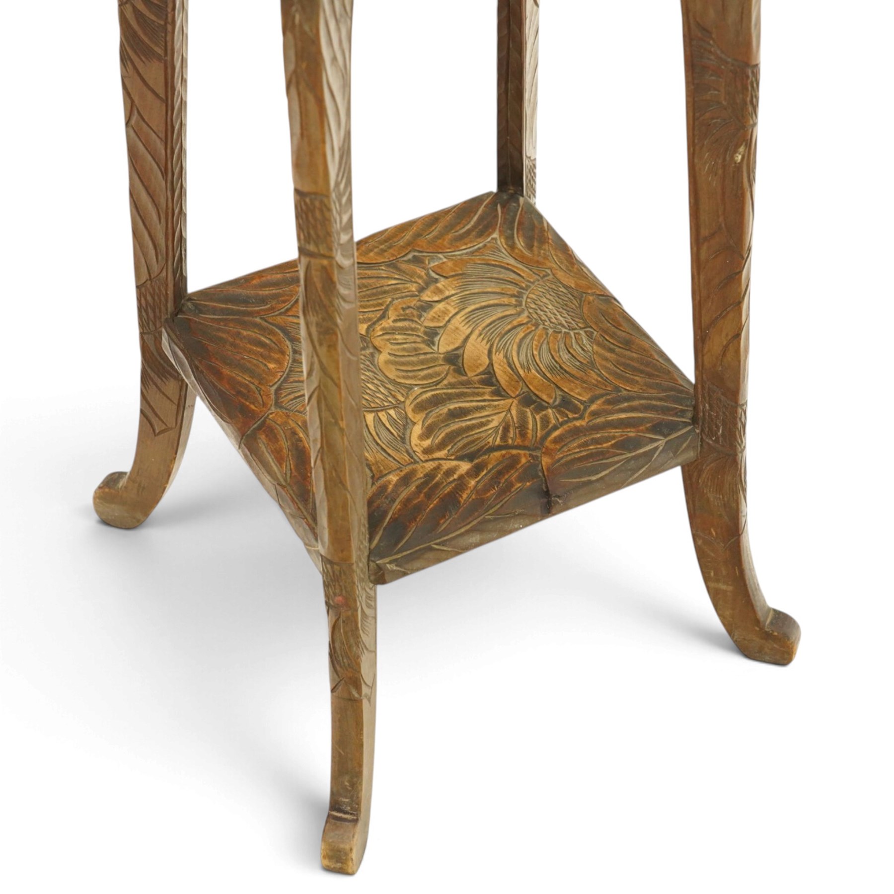 Attrib. Liberty & Co. - Arts & Crafts carved Japanese pattern two-tier occasional table, the square top with rounded corners heavily carved foliate motifs, raised on tapering supports with scroll feet united by undertier