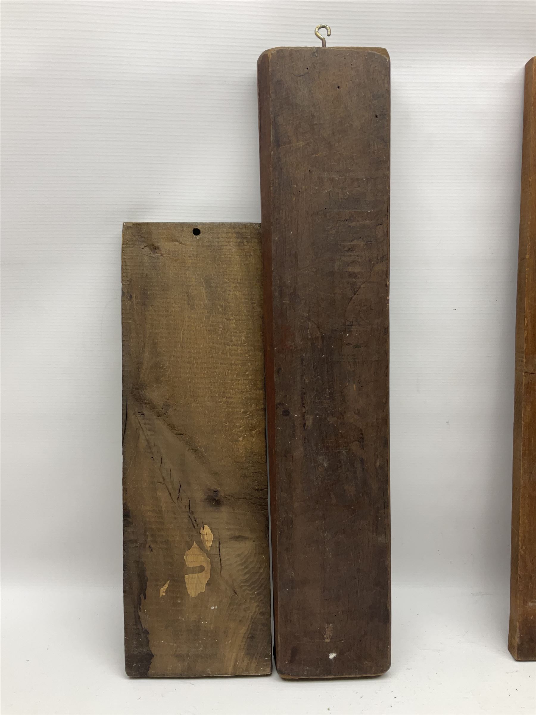 Eight 20th century hardwood Dutch folk art Speculaasplank or biscuit moulds, most examples typically carved with figures in traditional dress, tallest H60cm