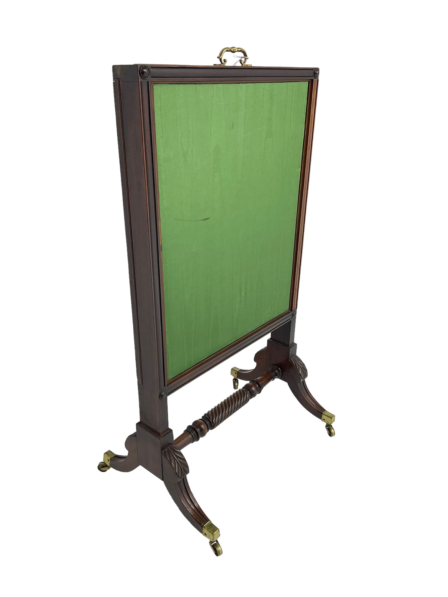 Regency mahogany screen with two horizontal and one vertical pull-out panels, on base with carved sabre legs and rope-twist stretcher