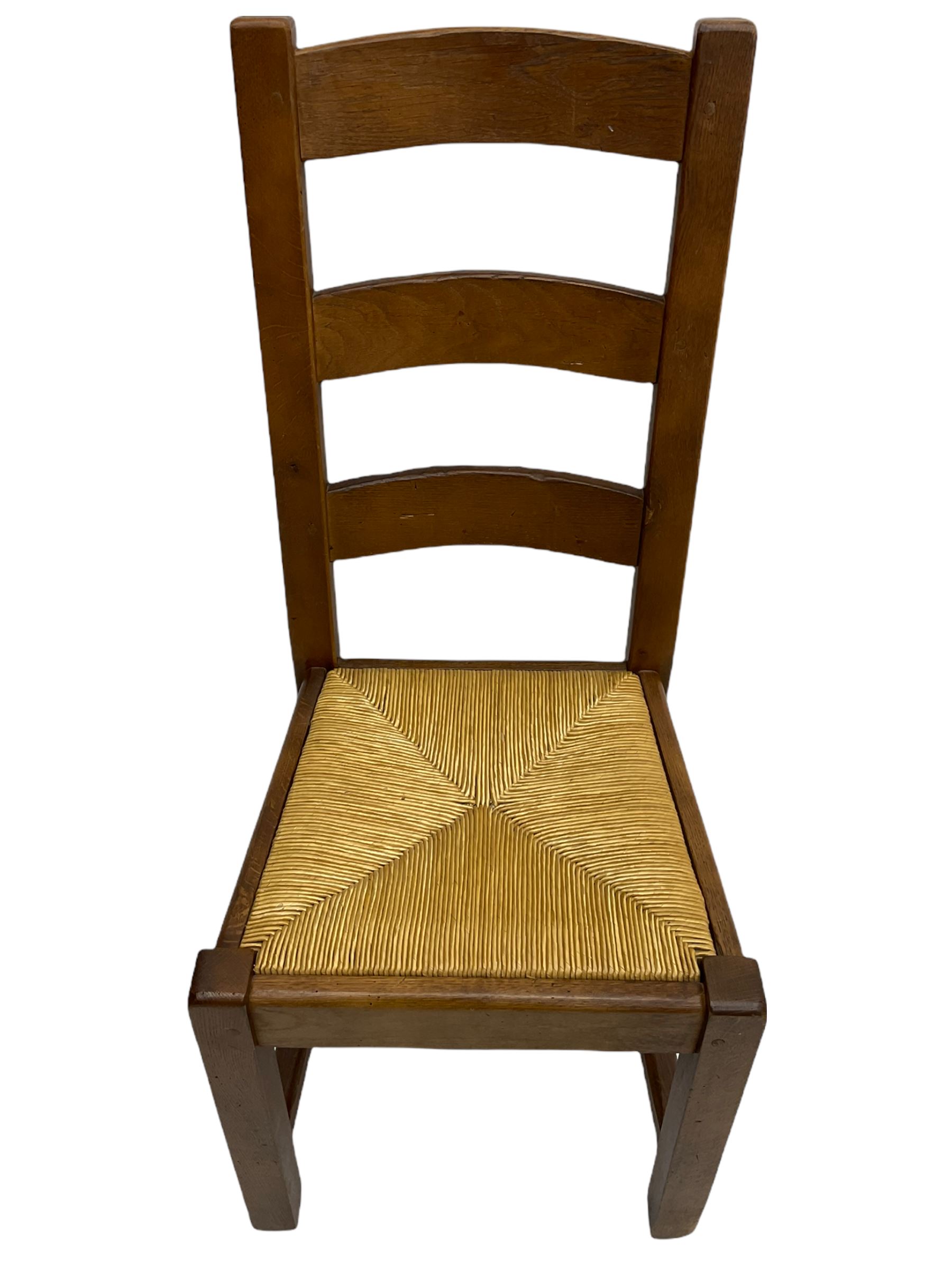 Antix French oak dining table with two leaves, two frieze drawers;, and six ladder back chairs with rush seats