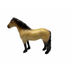 Beswick horse figures, comprising Highland Pony 1644, and another, probably Aran Bahram in grey, each with printed mark beneath.
