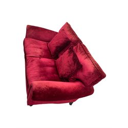 Laura Ashley - two seat sofa upholstered in red velvet fabric, turned mahogany feet with brass castors