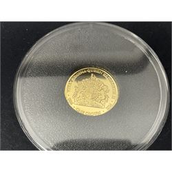 Queen Elizabeth II 2000 'The Queen Mother' silver proof five pound coin, 2000 'Millennium' silver proof five pounds, 2007 'Scouts' silver proof fifty pence, Tristan Da Cunha 2014 9ct gold 1 gram gold one crown coin, all cased with certificates and a 'Prince Charles 60th Birthday Commemorative Coin Cover' containing a 2008 silver proof five pound coin in folder (5)