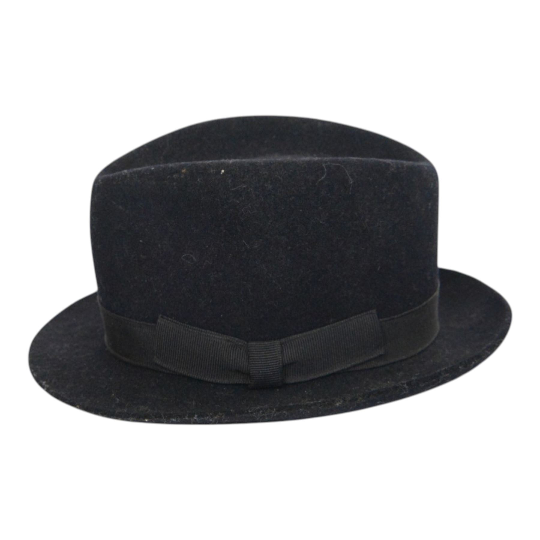 Two Attaboy tradesman or miniature trilbies, in black miniature hat boxes, one with a certificate 'Believe it or not! this miniature 'Attaboy' is half the size of an ordinary 'Attaboy' hat' together with a miniature flat cap, trilby H7cm     