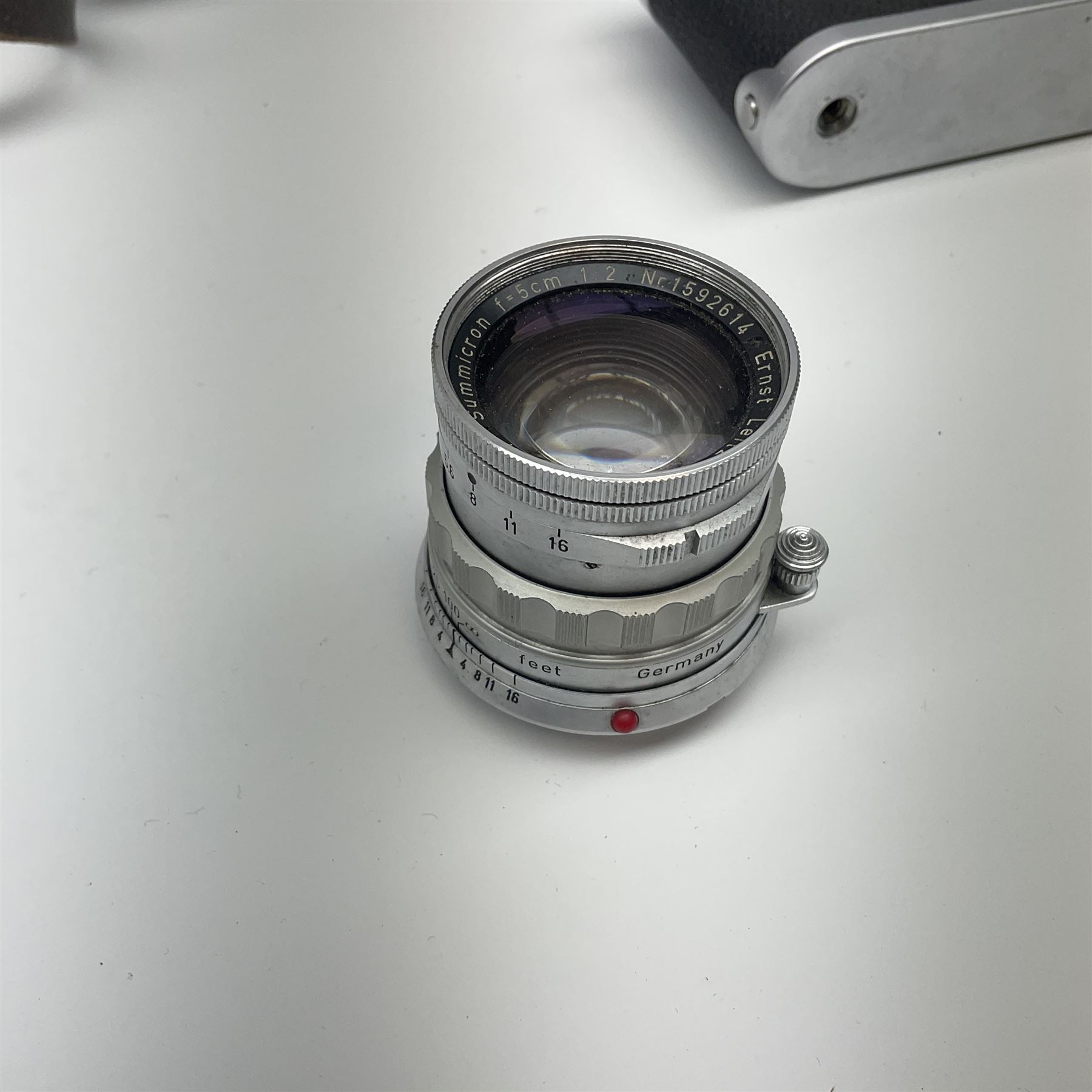 Leica M3 camera body, 1959, chrome finish, serial number '986937', fitted with 'Ernst Leitz GmbH Wetzlar Summicron f=5cm 1:2 Nr.1592614' lens, with Leica M3 instruction booklet