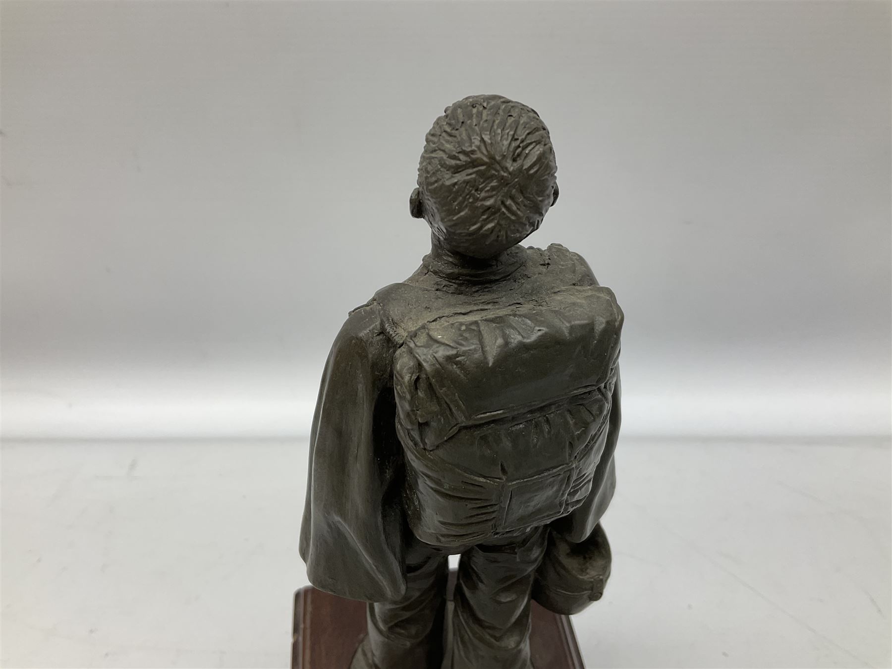 Presentation bronzed figure of a paratrooper by Peter Hicks mounted on a mahogany plinth with plaque inscribed ' Presented to Lieutenant General Sir Michael Gray KCB OBE President Army Parachute Association 1981-1987 An Outstanding Term of Leadership Friendship and Humour. Thank You All Ranks A.P.A.' H28cm; a brass Pegasus plaque H12cm; and small quantity of colour photographs and prints of military related paintings