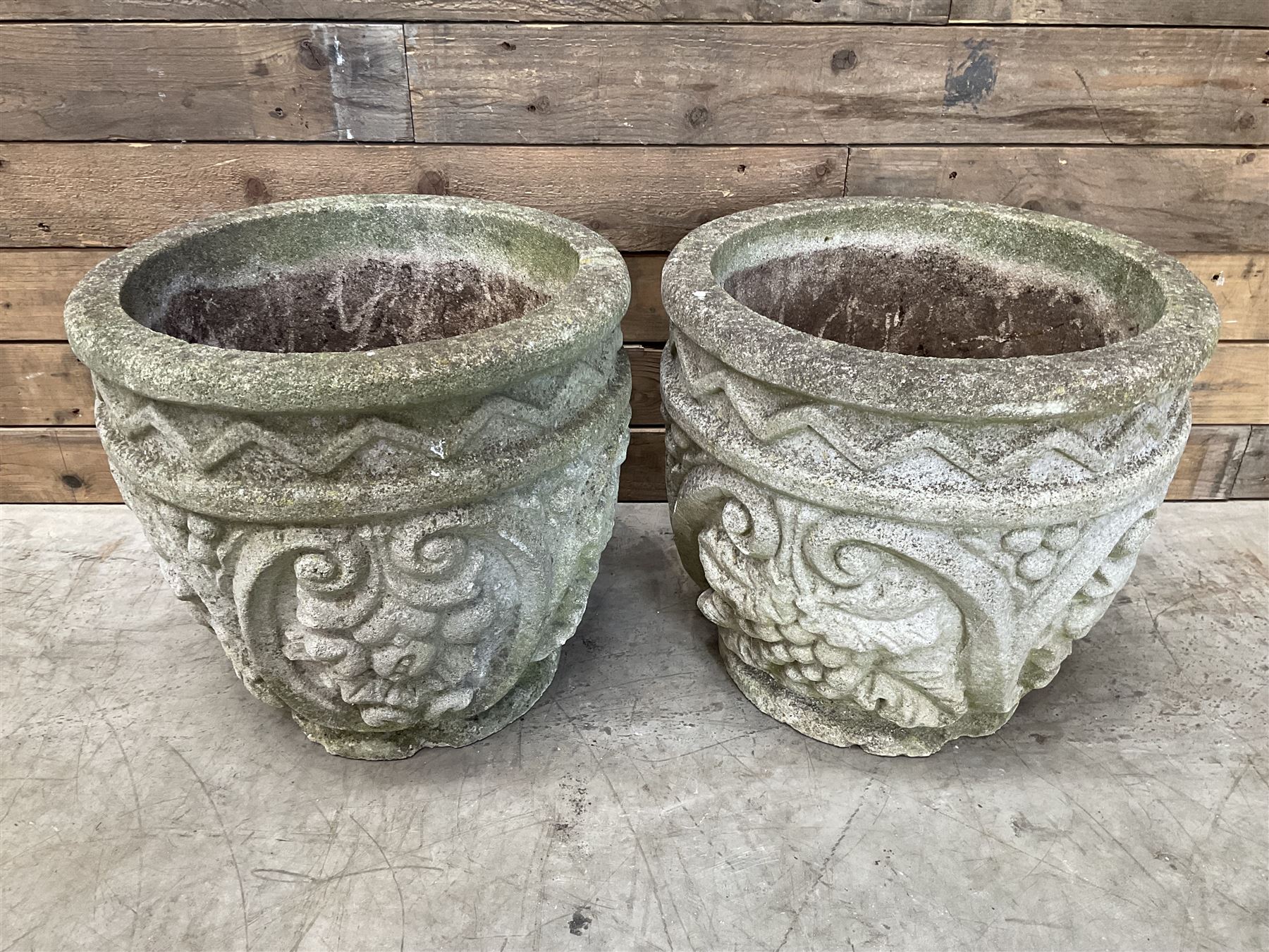 Pair of cast stone ornate circular planters