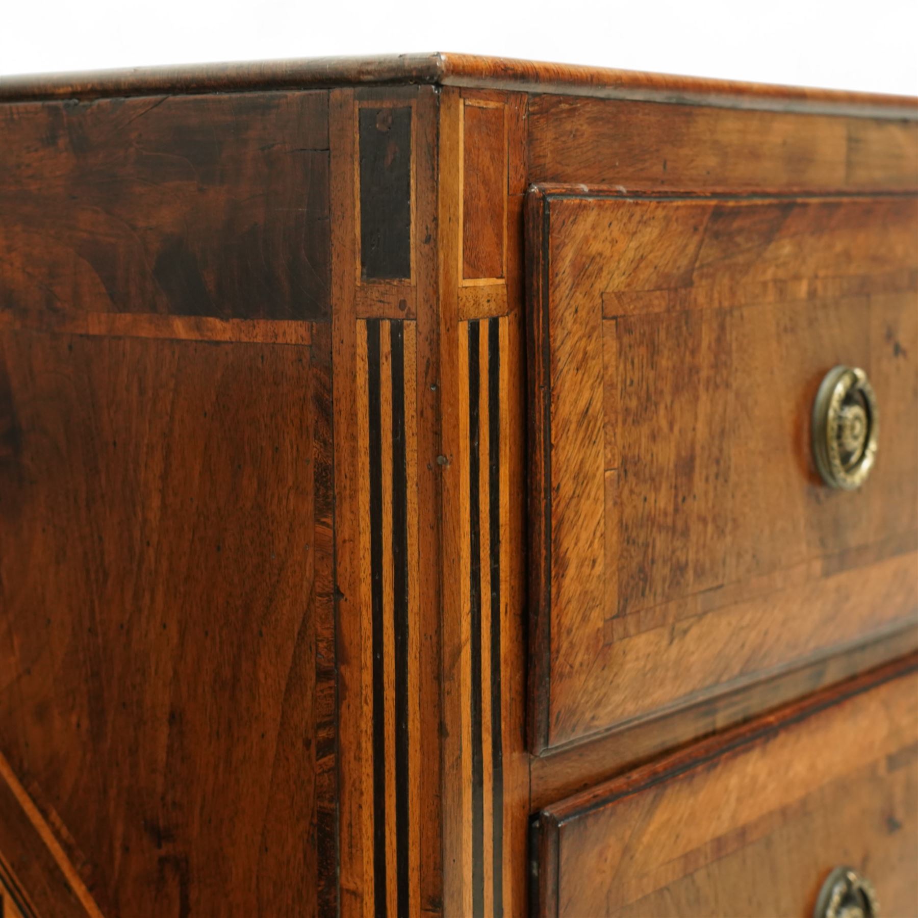 Large 18th-century North Italian walnut commode, rectangular top with quartered veneer, central parquetry inlay and raised moulded edges above three drawers with brass ring handles, cross banding and further central parquetry inlay, supported on square tapered feet