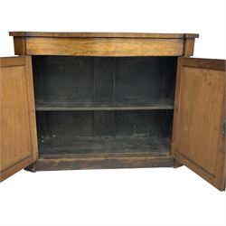 William IV rosewood serpentine chiffonier, fitted with frieze drawer over two panelled cupboard doors with applied C-scroll decoration, flanked by canted uprights with moulded foliate corbels