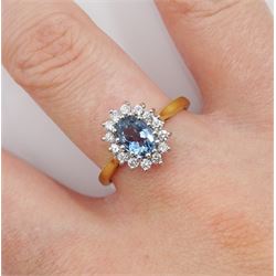 18ct gold aquamarine and round brilliant cut diamond cluster ring, London 2000, aquamarine approx 0.60 carat