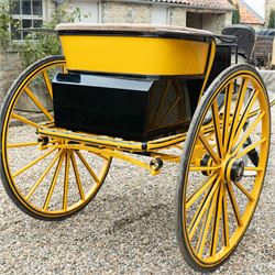Victorian Two Wheeled Pleasure Driving Round Back Gig by Shanks of London

A Victorian two wheeled pleasure driving round back gig, painted in black and yellow, with upholstered forward facing seat for two, panelled dashboard, wooden spoked wheels, iron step and shafts for a single horse. The vehicle is fitted with a rear luggage compartment and mounted on elliptic springs.

Features
• Black and yellow painted body
• Upholstered forward facing seat
• Panelled dashboard
• Rear luggage compartment
• Wooden spoked wheels
• Iron step
• Elliptic spring suspension
• Shafts for a single horse

Dimensions:
Overall length: 310 cm
Width: 160 cm
Body width: 82 cm
Height: 160 cm

Wheel Diameters:
Wheels: 138 cm

Seating:
Driver and passenger: 2