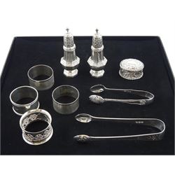  Pair of George III silver sugar tongs by Stephen Adams II, London 1811, pair of silver cruets by Whitehill Silver & Plate Co, four silver napkin rings, silver pill box and pair of sugar tongs, all hallmarked, approx 7.2oz