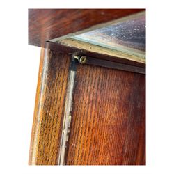 Early 20th century oak stacking library bookcase, four sections enclosed by hinged and sliding glazed doors, fitted with single drawer 