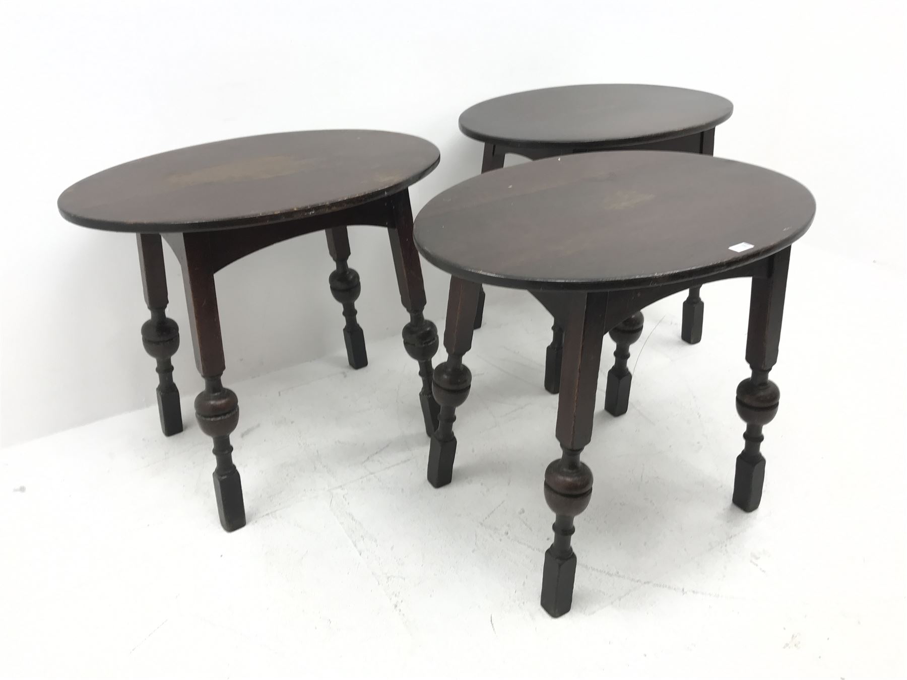 Three oval bog oak bar tables, square supports with cup and cover detailing
