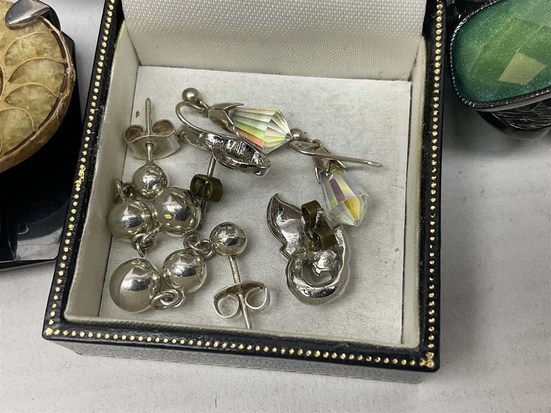 Silver ammonite pendant, silver earrings and a collection of beaded and other costume jewellery