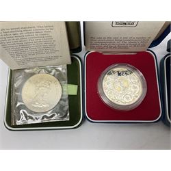 Seven The Royal Mint United Kingdom sterling silver proof crown coins, comprising two 1972, three 1977, 1981 and 1993, all cased with certificates and a Queen Elizabeth II 2001 one ounce fine silver Britannia coin on card (8)