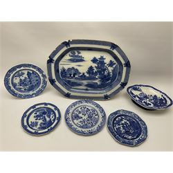 A group of 19th century Spode blue and white transfer printed pottery, various patterns including Buffalo, Forest Landscape, Grasshopper, Two Figures, Buddleia, and a Willow pattern variant supper section dish. 