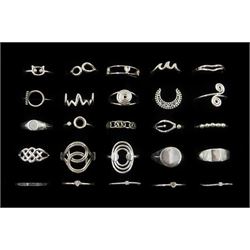 Twenty-five silver rings including crescent, Celtic design, swirl and bead