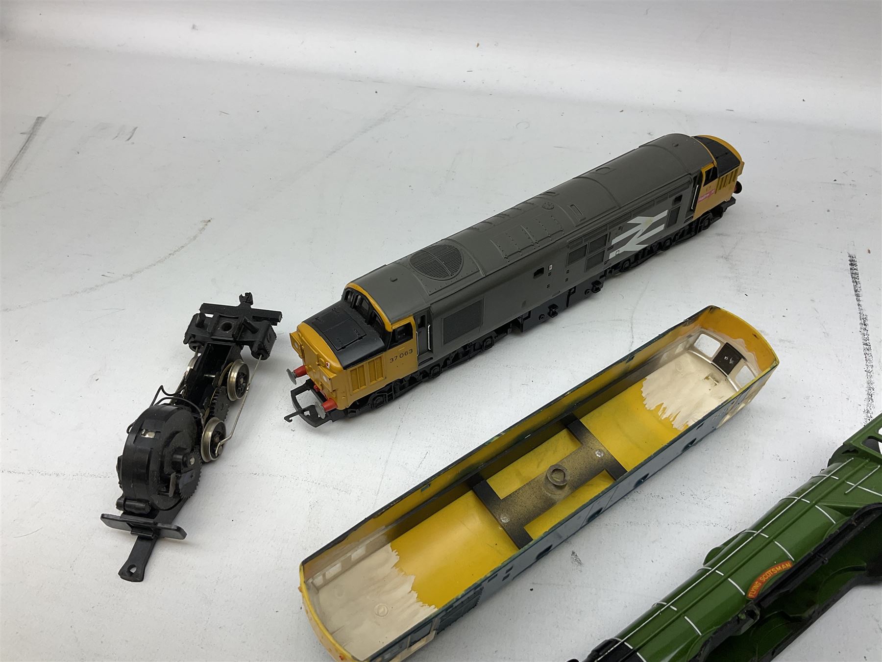 '00' gauge - Tri-ang 'Caledonian Single' Class 4-2-2 locomotive and tender; Hornby Class 37 Diesel (English Electric Type 3) locomotive No.37063; Airfix Class 61XX 2-6-2 Prairie tank locomotive No.6167; Pocher Italy American style 4-4-0 locomotive 'Reno'; and a quantity of part locomotives, spare parts etc; all unboxed