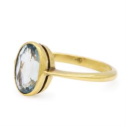 Early 20th century 18ct gold aquamarine ring, set with a single bezel set, oval cut aquamarine of approx 1.05 carat