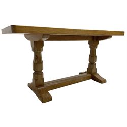 Mouseman - oak coffee table, adzed rectangular top on octagonal supports, on sledge feet united by floor stretcher, carved with mouse signature, by the workshop of Robert Thompson, Kilburn