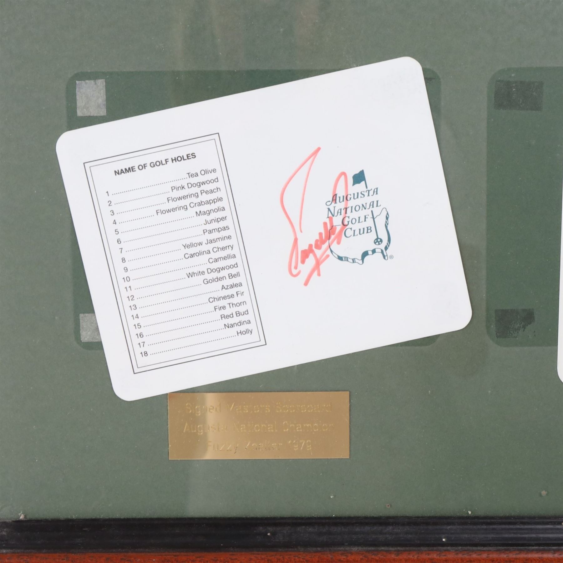 Signed golf memorabilia, to include 1988 US Masters Champion Augusta National flag, signed by Sandy Lyle, a golfing glove signed by Nick Faldo, two signed 2002 Ryder Cup prints, 1979 Masters scorecard signed by Fuzzy Zoeller displayed with a 1980 Masters scorecard signed by Seve Ballesteros, all framed, largest frame H60cm