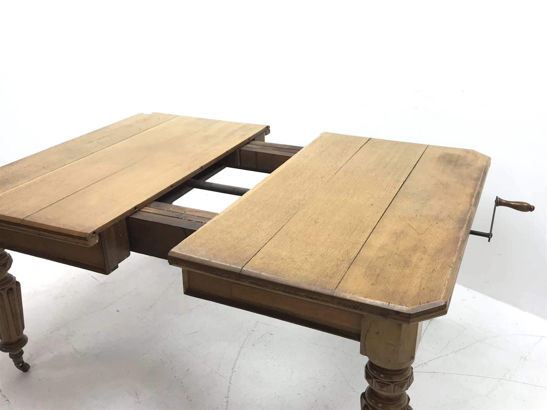 *Edwardian oak telescopic extending dining table, canted rectangular