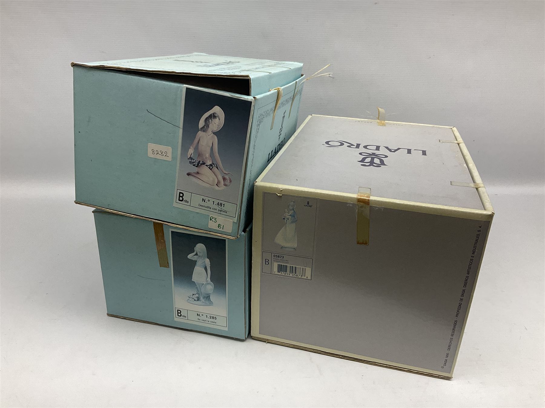 Three Lladro figures, comprising Modern Mother no 5873, Dropping the Flowers no 1285 and On the Beach no 1481, all with original boxes, largest example H30cm