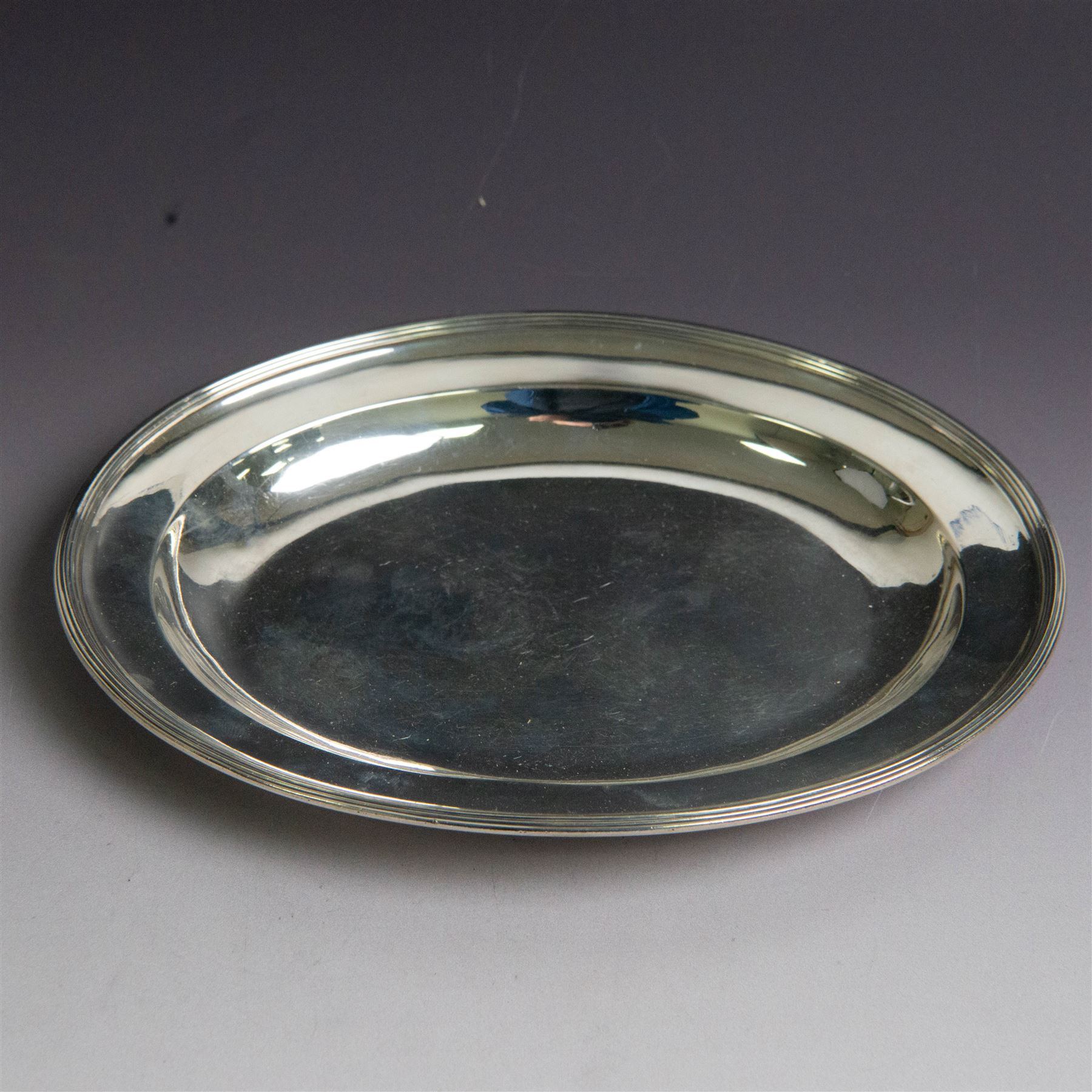 George III silver paten, of oval form, hallmarked Peter, Ann & William Bateman, London 1803, W21.5cm