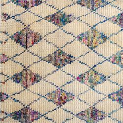 Contemporary Moroccan Berber design wool rug, cream field with blue diamond lattice, decorated with repeating multicoloured lozenge motifs, short fringe ends and bound sides