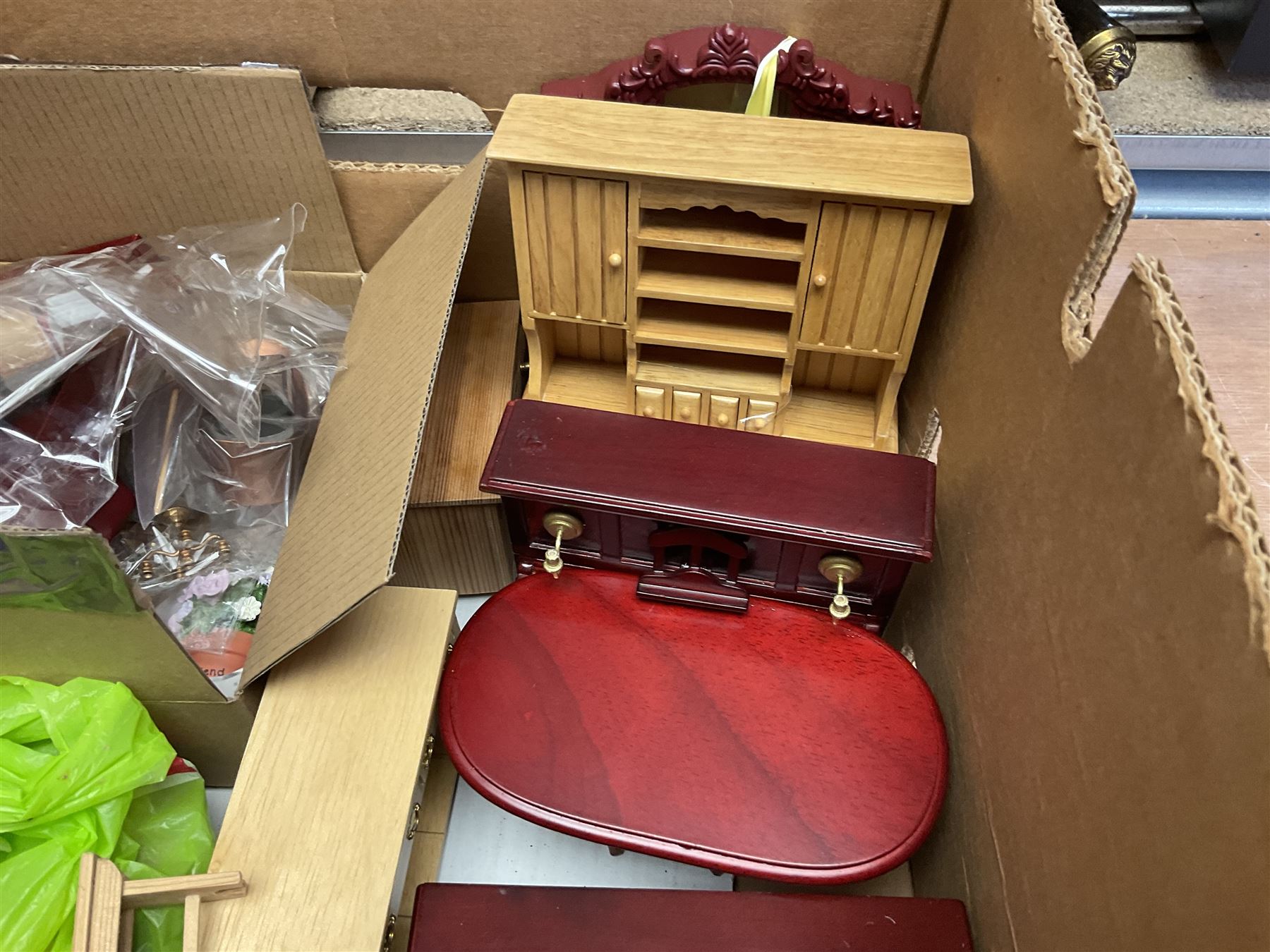 'The Hollies' - good quality sectional wooden doll's house in the form of a Georgian style four-storey bay windowed town house with simulated brick front elevation, rendered sides, off-set corner stonework, faux slate-hung top floor with flat roof and chimney stack, working sash windows, iron railings around front basement courtyard with hinged front elevation to two rooms with  spiral staircase, side hinged central section approached by external steps with iron balustrades to the sides leading to a front door, entrance hall with stairs to landing and two rooms on two floors with dado panelling and fire-surrounds, the top floor with top hung front elevation revealing stairs to a landing and bedroom; wired for electricity L51cm D65cm H107cm including chimney; together with a good quantity of quality wooden furniture and accessories including piano, dressers, bookcase and books, rugs, double half-tester bed, metalware, pictures etc