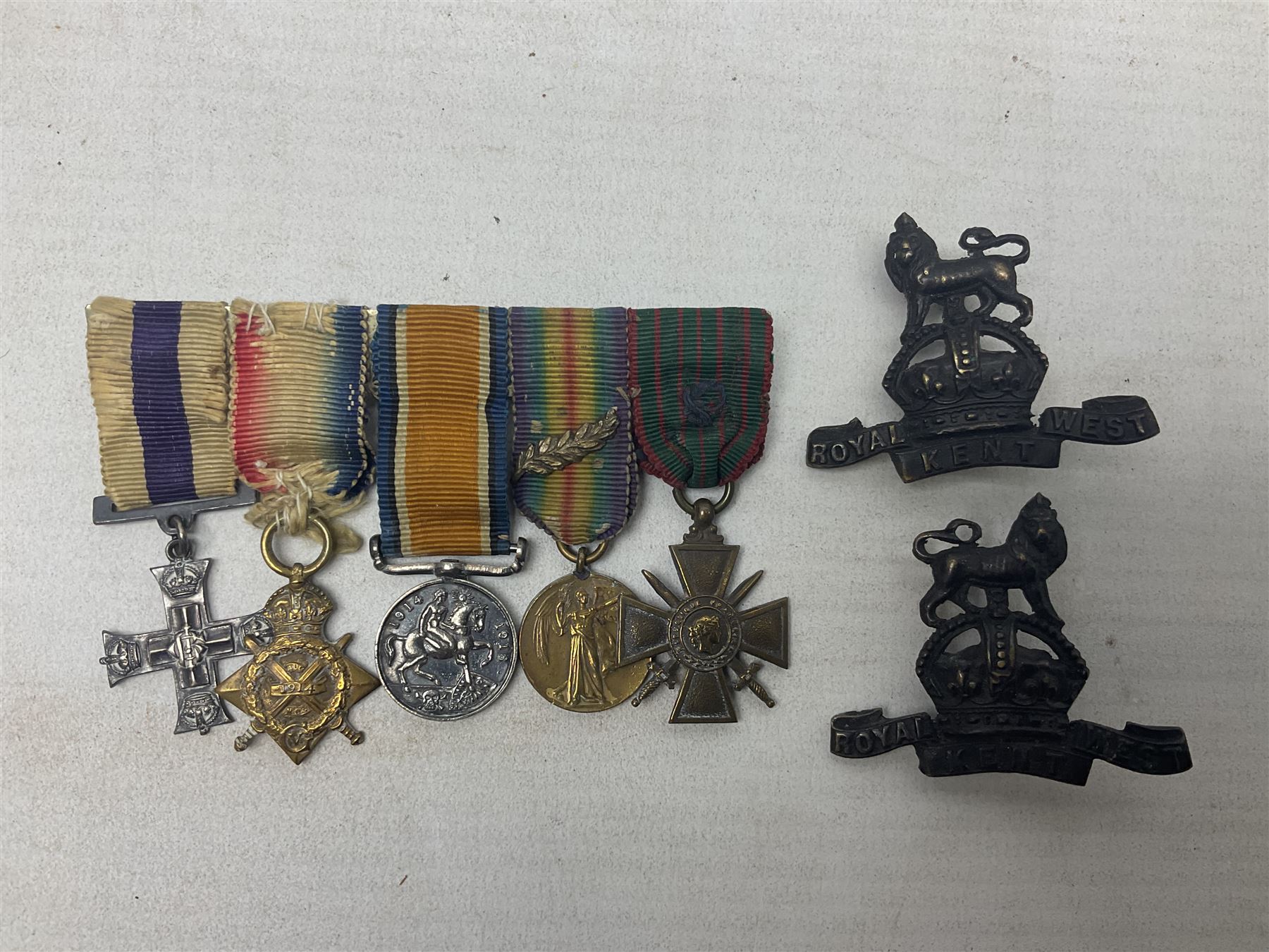 WW1/WW2 Military Cross group of five medals comprising M.C., 1914 Star with date clasp to 34156 Sjt. G. Ferguson R.F.A., British War Medal and Victory Medal with MID leaves to Major G. Ferguson, WW1 French Croix De Guerre with MID Star and WW2 Defence Medal; all with ribbons on pinned wearing bar; WW1 group of five miniature dress medals; two Royal West Kent cap badges; early 20th century silver cigarette case engraved with GF monogram and adapted as a photograph holder with image of Ferguson in civilian clothing; presentation Rotary 9ct gold cased wrist-watch with 1931 British Legion inscription verso; and archive of ephemera including 1914 MID certificate; WW2 Home Guard certificate; over twenty career spanning photographs of Regimental groups, portraits, Sandhurst etc; 1914 Commission document to 2nd Lieutenant; 11th Brigade R.F.A. Roll of Honour 1914-18; 'Soldier's Small Book'; Army Book 439 etc