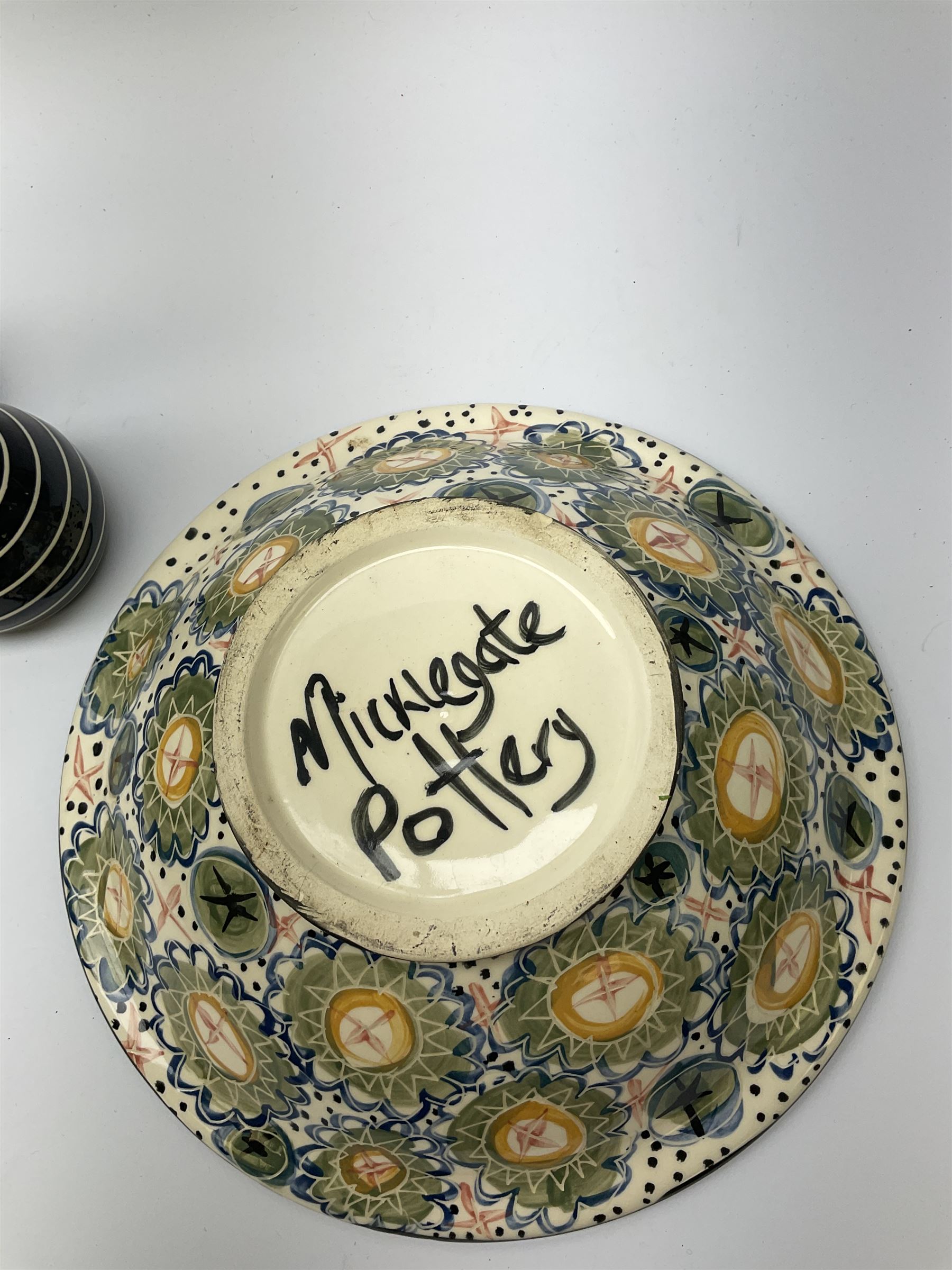 A group of assorted Studio Pottery, to include various Cornish Celtic Pottery, Wold pottery bowl, Micklegate pottery bowl, a small Troika style vase of cylindrical form, etc. 