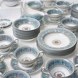 Wedgwood turquoise Florentine part service, comprising large covered tureen and stand, coffee pot, teapot, two covered sucriers, milk jug, two sauce boats and stands, seven soup plates, three bowls, jug, eighteen soup bowls and fifteen stands, two ashtrays, thirteen further saucers, twelve teacups and eleven saucers, and twenty-one further plates of varying sizes
