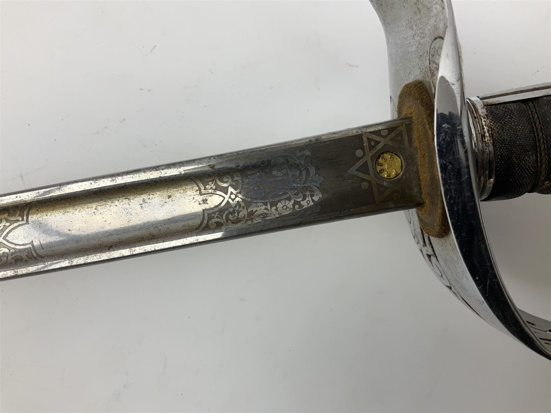 British George V 1897 Pattern Infantry Officers Sword, the 82.5cm fullered steel blade etched and polished with crowned royal arms, GRV cyphers and scrolling foliage, marked Army & Navy Co-operative Society 105 Victoria St London SW to the ricasso,  plated pierced basket hilt with wire bound fish skin grip and leather knot, No.15032; in leather covered scabbard