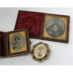 A 19th century ambrotype miniature of a gentleman, within a foliate engraved mount and plush lined leather case, together with another similar smaller example, a Victorian pinchbeck swivel brooch containing a two photographic portraits.