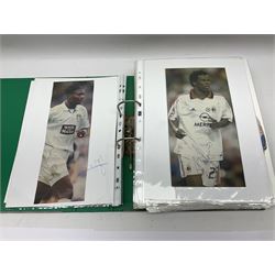 Collection of approximately 200 Leeds United related autographs, predominantly signed newspaper cuttings, contained within ring binder, together with a number of loose examples