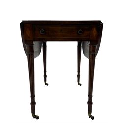George III mahogany Pembroke table, drop-leaf oval top with satinwood band, fitted with single end drawer, inlaid with satinwood lozenge motifs, on turned and reeded supports with brass cups and castors