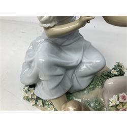 Lladro figure, As Pretty as a Flower Mother, modelled as a figure with 'lace' umbrella and dog at feet gesturing towards child with basket of flowers, upon a naturalistically modelled base with encrusted flower detail, H27cm