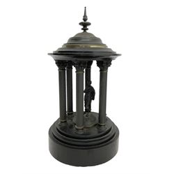 French- Black Belgium slate 8-day Victorian mantel clock  and garnitures with with malachite inlay, drum cased movement with volutes curved supports to the sides, two-part enamel dial with Roman numerals, moon hands and a visible Brocot escapement, striking movement, striking the hours and half-hours on a bell, with matching portico garni in the form of a Roman temple. With pendulum.