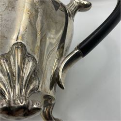 Five piece Edwardian silver tea service, comprising teapot and coffee pot, each with ebonised scroll handle, tea caddy with hinged cover, twin handled open sucrier, and milk jug, each of rounded bombe form, upon four paw feet, hallmarked William Adams Ltd, Birmingham 1904 and 1905, coffee pot H26cm
