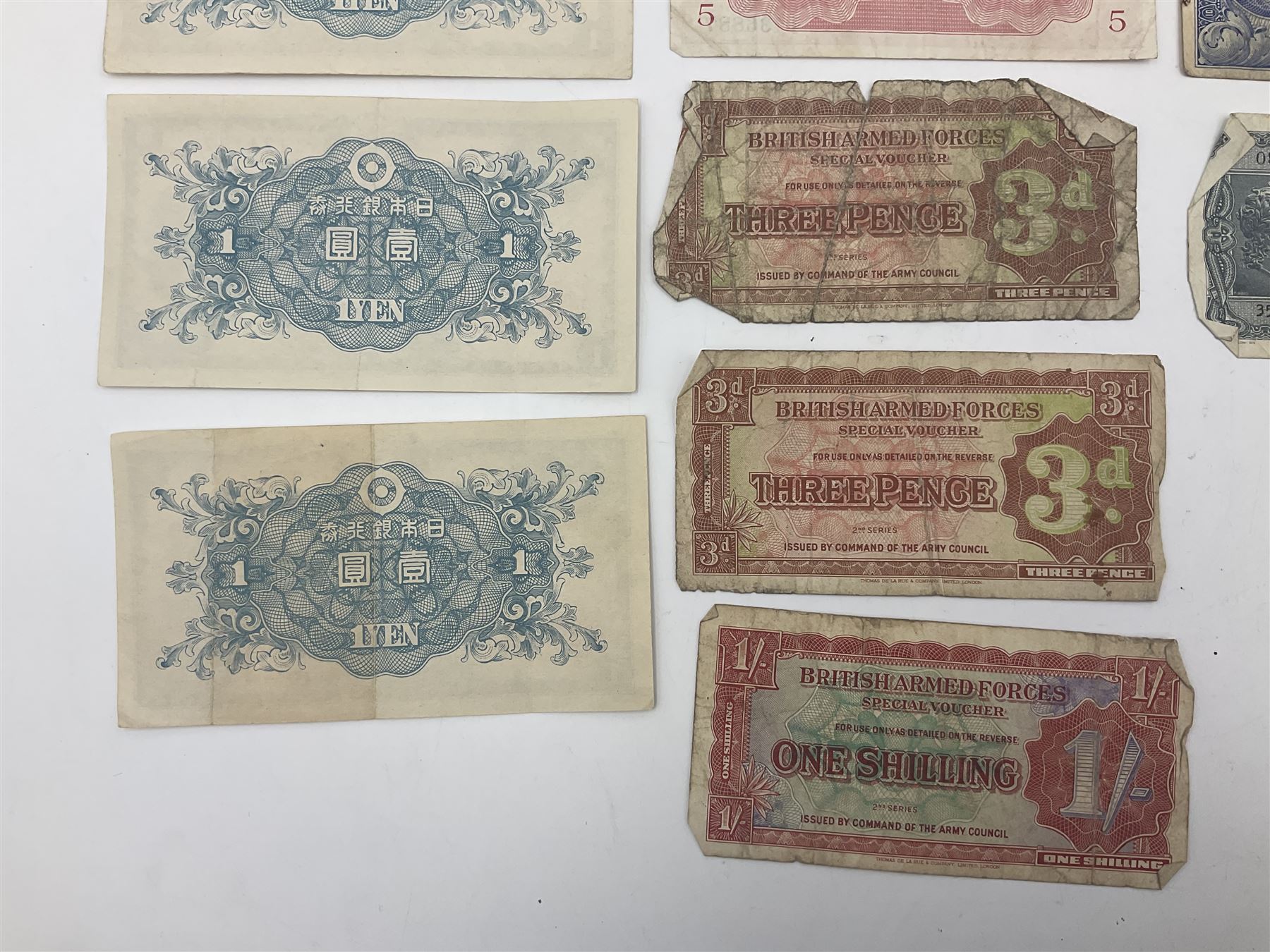 Banknotes including King George VI board of commissioners of currency Malaya one dollar 1st July 1941 'P/59 030908', Queen Elizabeth II Government of Hongkong one dollar 1st July 1952 'F/6 202153' etc
